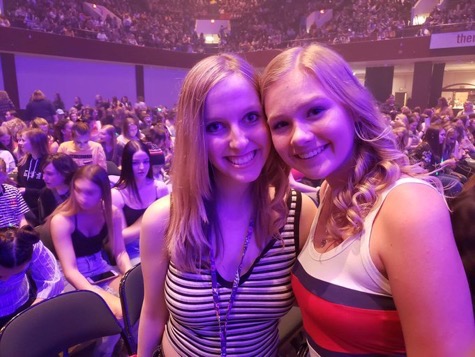 Sydney at a concert smiling with her best friend Ashley